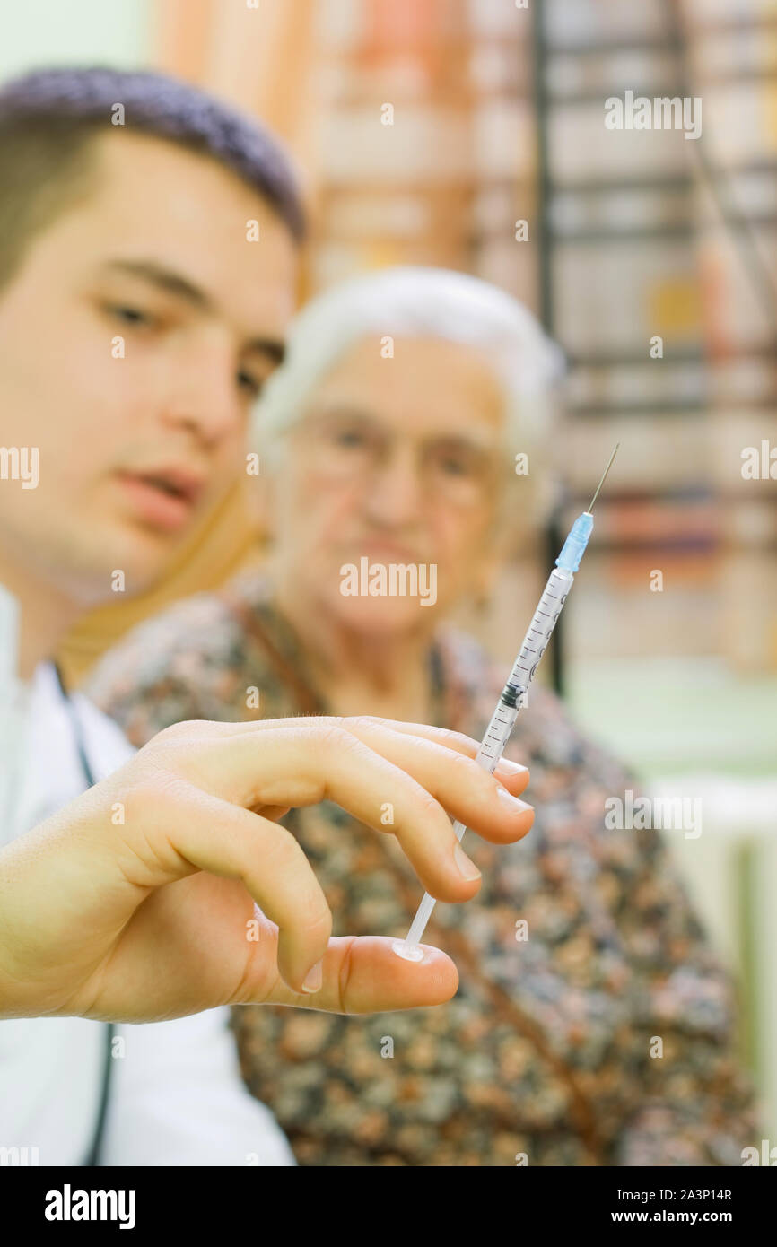 Old Practice Injection The doctor gives old woman's an injection Stock Photo - Alamy