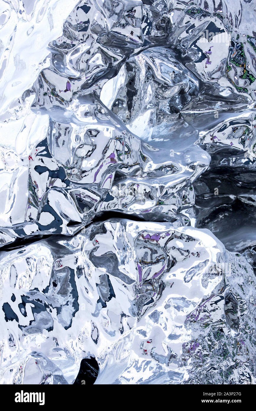 Abstract liquid like silver metal background vertical Stock Photo - Alamy