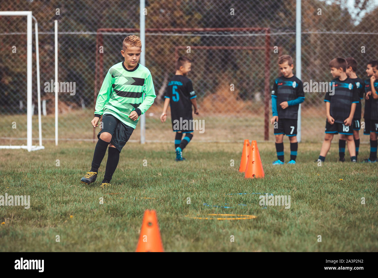 Soccer Drills The Slalom Drill Youth Soccer Practice Drills Young Football Player Training On Pitch Soccer Slalom Cone Drill Boy In Soccer Jerse Stock Photo Alamy