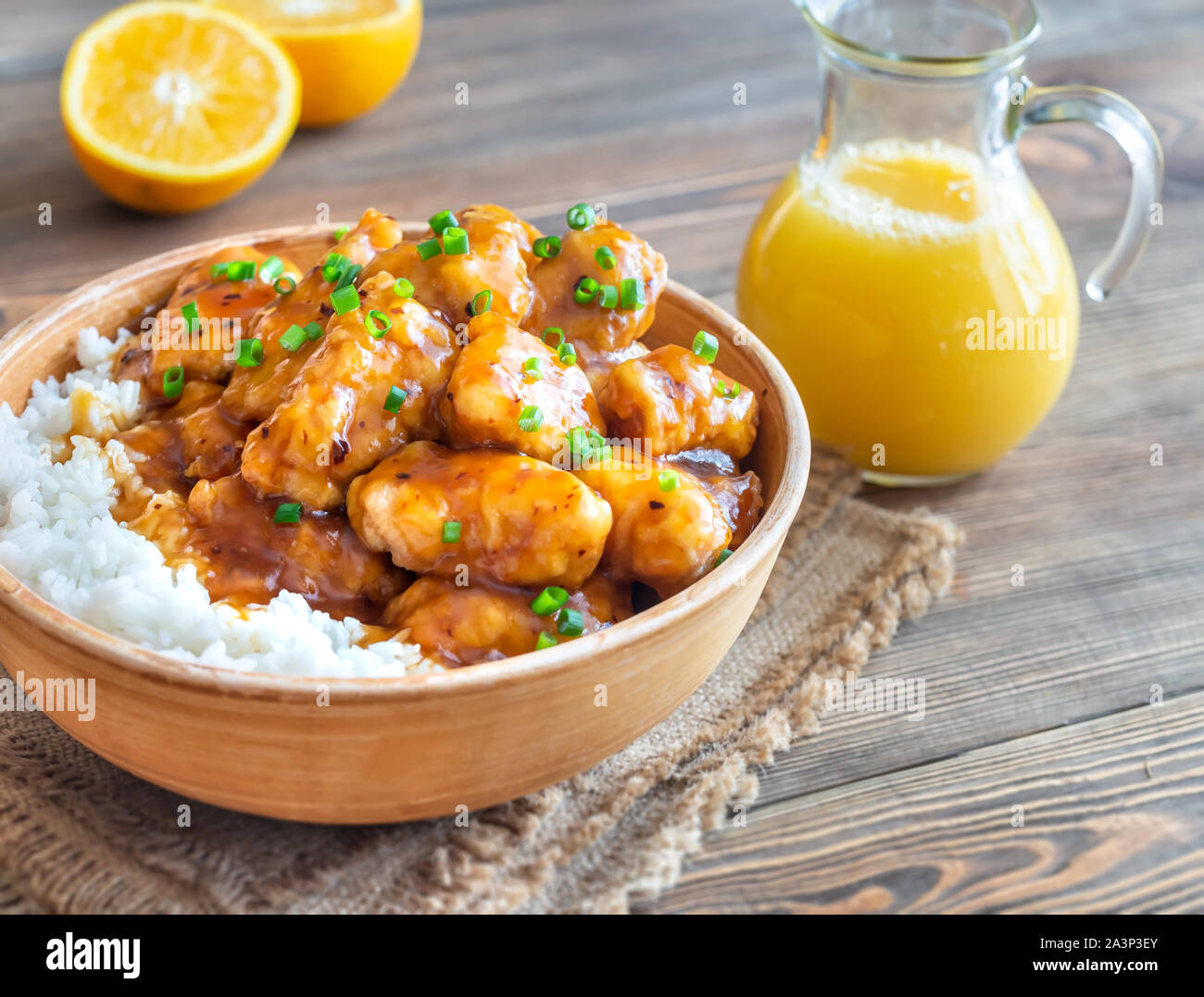 Bowl of orange chicken with white rice Stock Photo Alamy