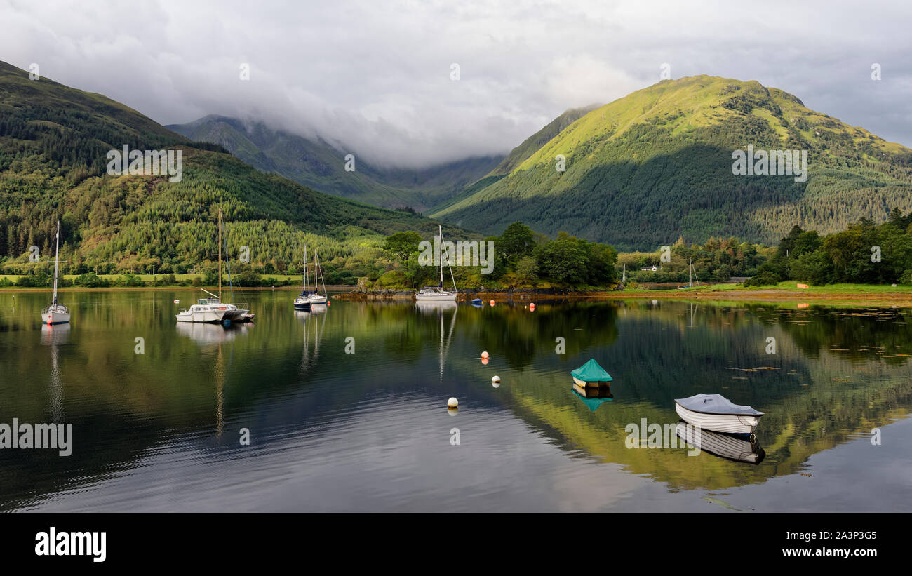 Poll an Dunain (Bishop's Bay), Gleann a'Chaolais with Creag Ghorm (758M right) and Sgorr Dhonuill (1001M in clouds), South Ballachulish, Highland, Sco Stock Photo