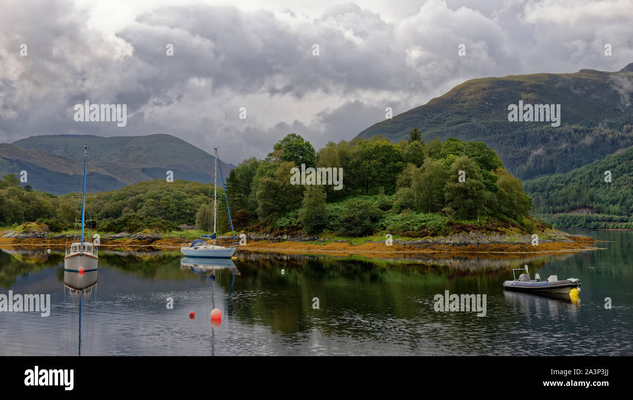Poll an Dunain (Bishop's Bay) and Eilean na h-Iuraiche with Glen Coe behind, viewed from north side of Loch Leven, Highland, Scotland, UK Stock Photo