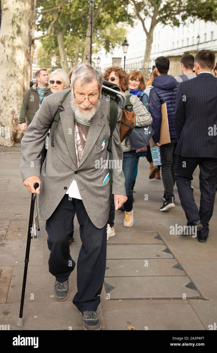 London, UK. 9th October 2019. Veteran protester, and Extinction Rebellion oldest British activist John Lynes, 91 of St Leonards-on-sea, East Sussex, here seen in Whitehall, Westminster, before his arrest. Credit: Joe Kuis / Alamy News Stock Photo