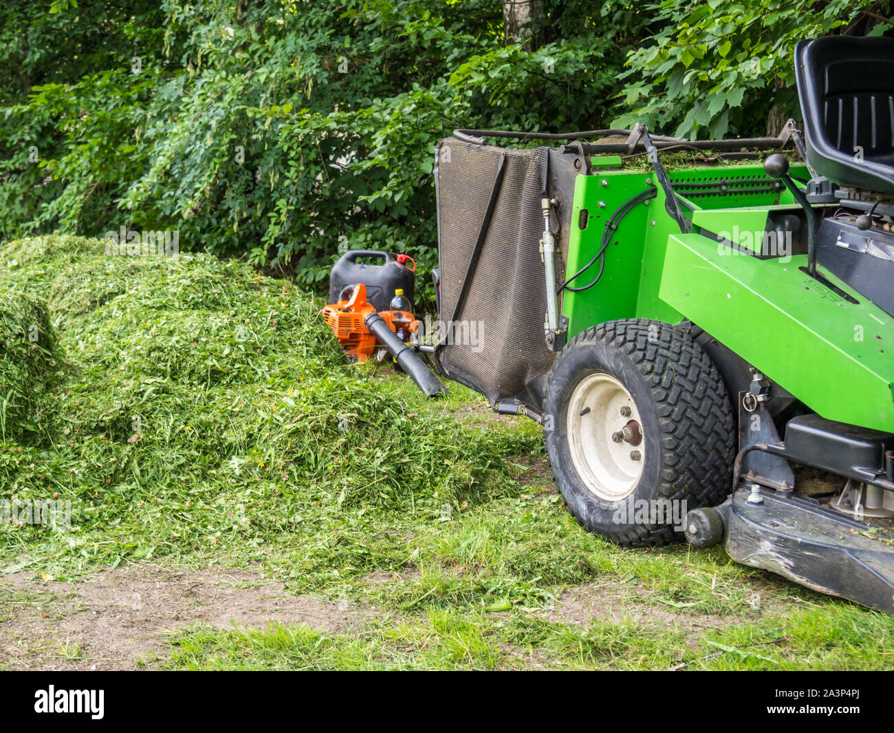 Tractor mowing lawn park hi-res stock photography and images - Alamy