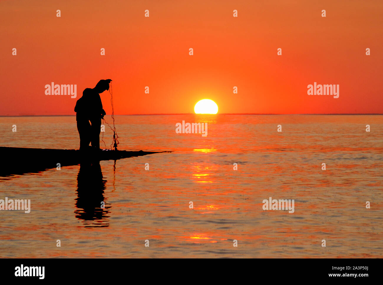 gone fishing at sunset Stock Photo