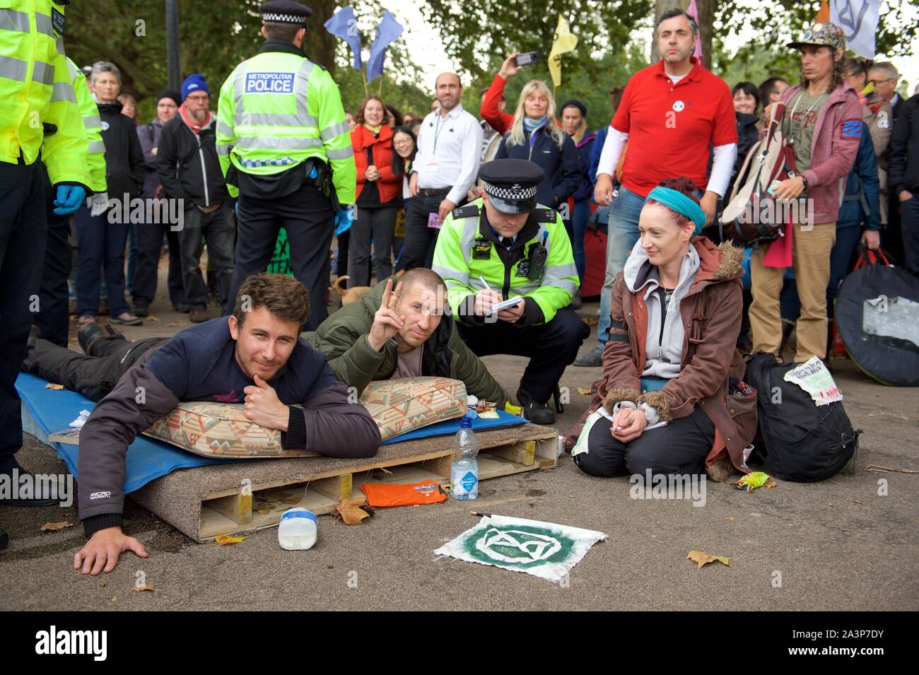 London, UK. 9th Oct, 2019. Police caution Extinction Rebellion protesters in London on 09 October 2019 in London, England. Protesters plan to blockade the London government district for a two week period, as part of 'International Rebellion' taking place in over 60 cities around the world, calling for decisive and immediate action from governments in the face of climate and ecological emergency. Photo by Alan Stanford. Credit: PRiME Media Images/Alamy Live News Stock Photo