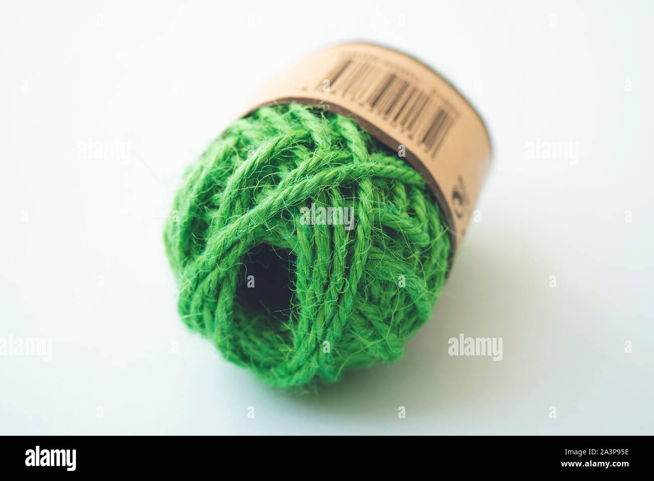 Green yarn balls as isolated white background, close up Stock Photo