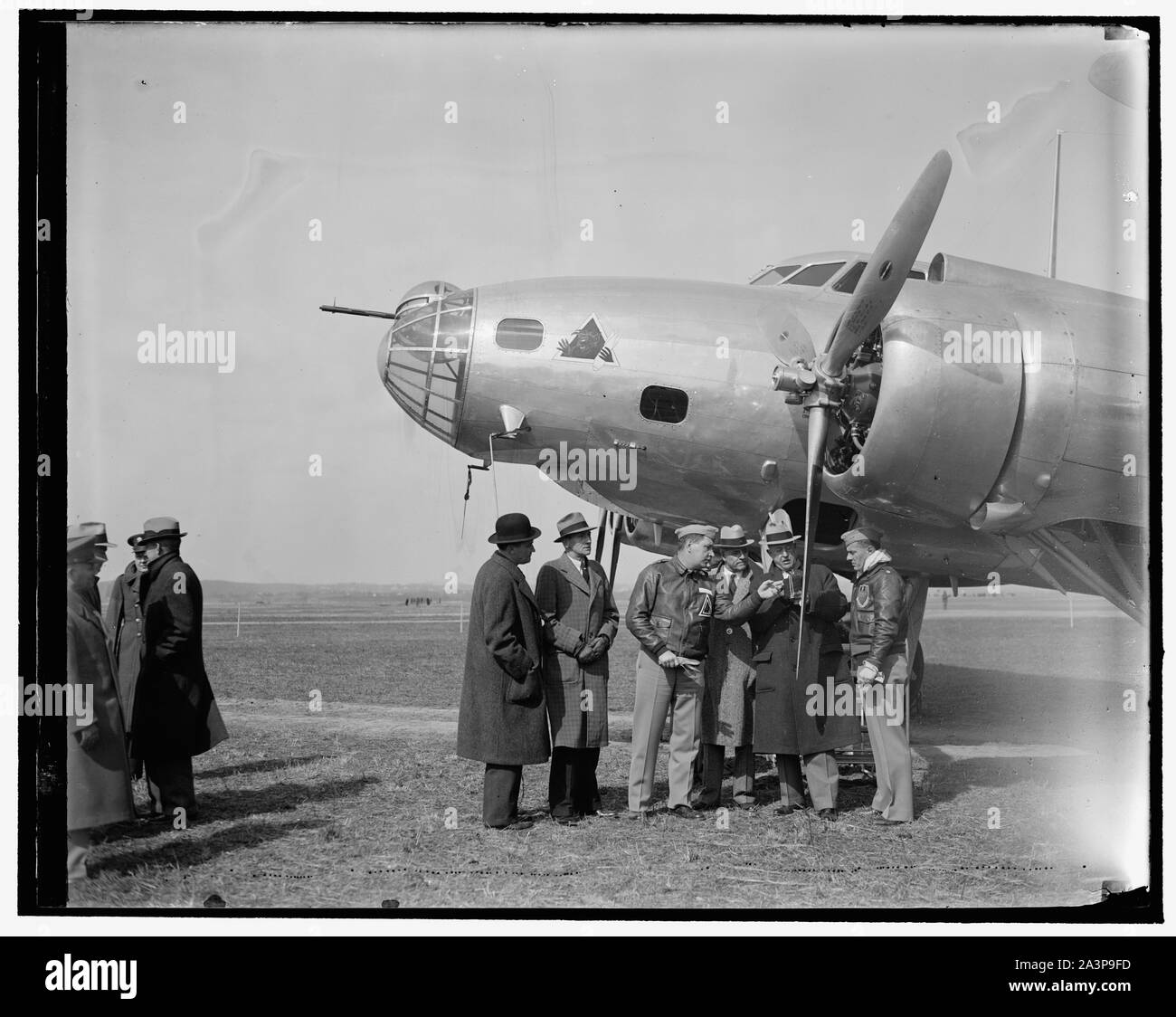 Solons inspect new Army Bomber. Washington, D.C. March 10. English: Solons inspect new Army Bomber. Washington, D.C. March 10. Members of the House Military Affairs Committee with U.S. Chief of staff General Mailin Craig inspecting the new 4-Engine Boeing Bomber which arrived at Bolling Field today. This ship is first of 13 which will be delivered to the Army Air Corps in the newer future. In the photograph, left to right, can't be seen: Rep. Andrew Edmiston, West Virginia Rep. Charles I. Faddis, Pa. Capt. C.E. O'Connor, pilot of the ship Rep. Andrew J. May, Kentucky Maj. Gen. Malin H. Craig Stock Photo