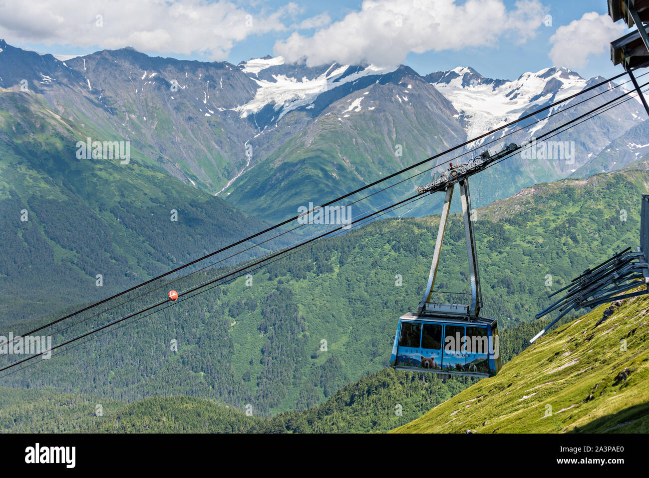 The Alyeska Aerial Tram climbs up the mountains in Girdwood, Alaska. The cable tram climbs 2,300 feet to the top of Mt. Alyeska in the Church Mountains. Stock Photo