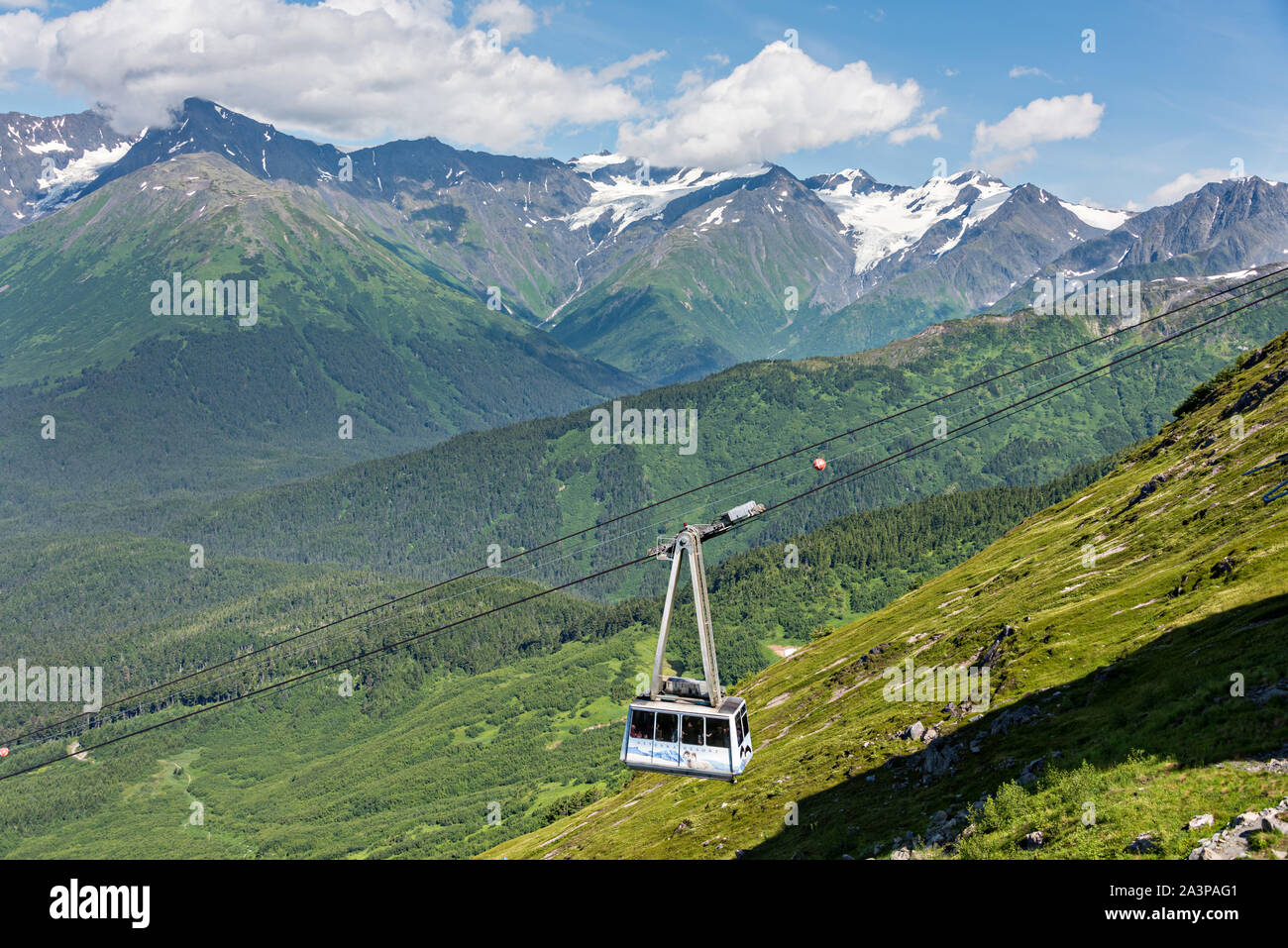 The Alyeska Aerial Tram climbs up the mountains in Girdwood, Alaska. The cable tram climbs 2,300 feet to the top of Mt. Alyeska in the Church Mountains. Stock Photo