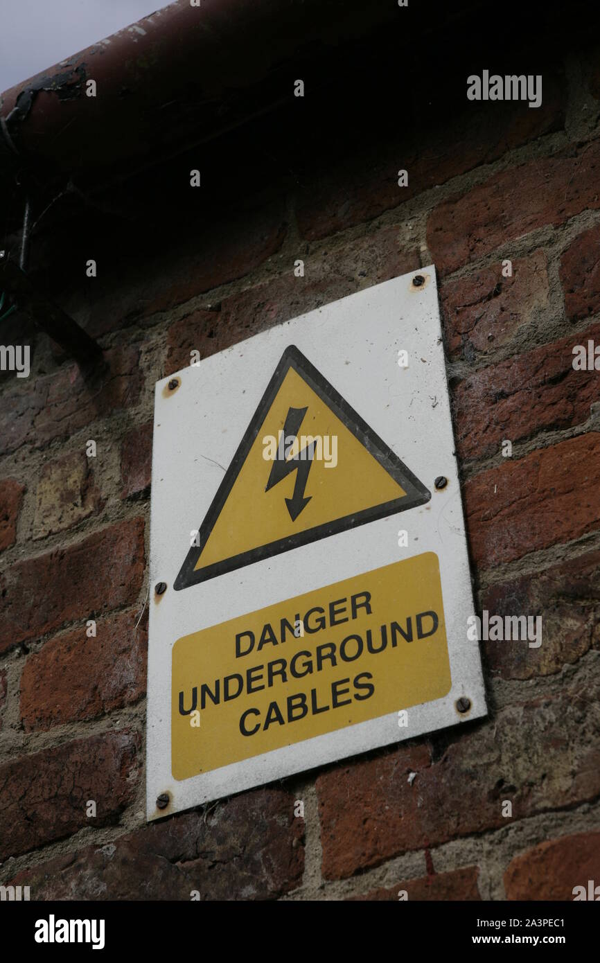 Danger Underground Cables Sign, warning of electricity cables