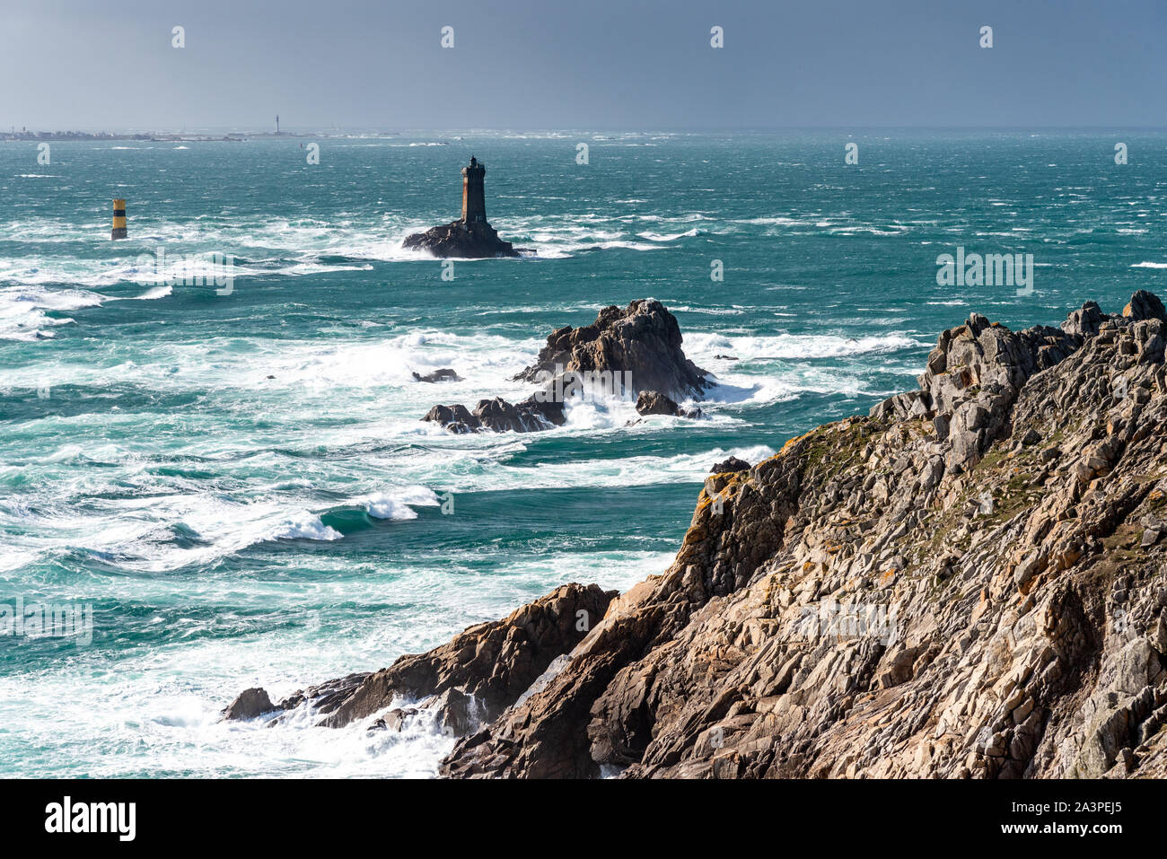 The Pointe du Raz, Brittany. This rocky cape faces the island of Sein. The giant waves of the Atlantic Ocean are shattered on the rocks. Stock Photo