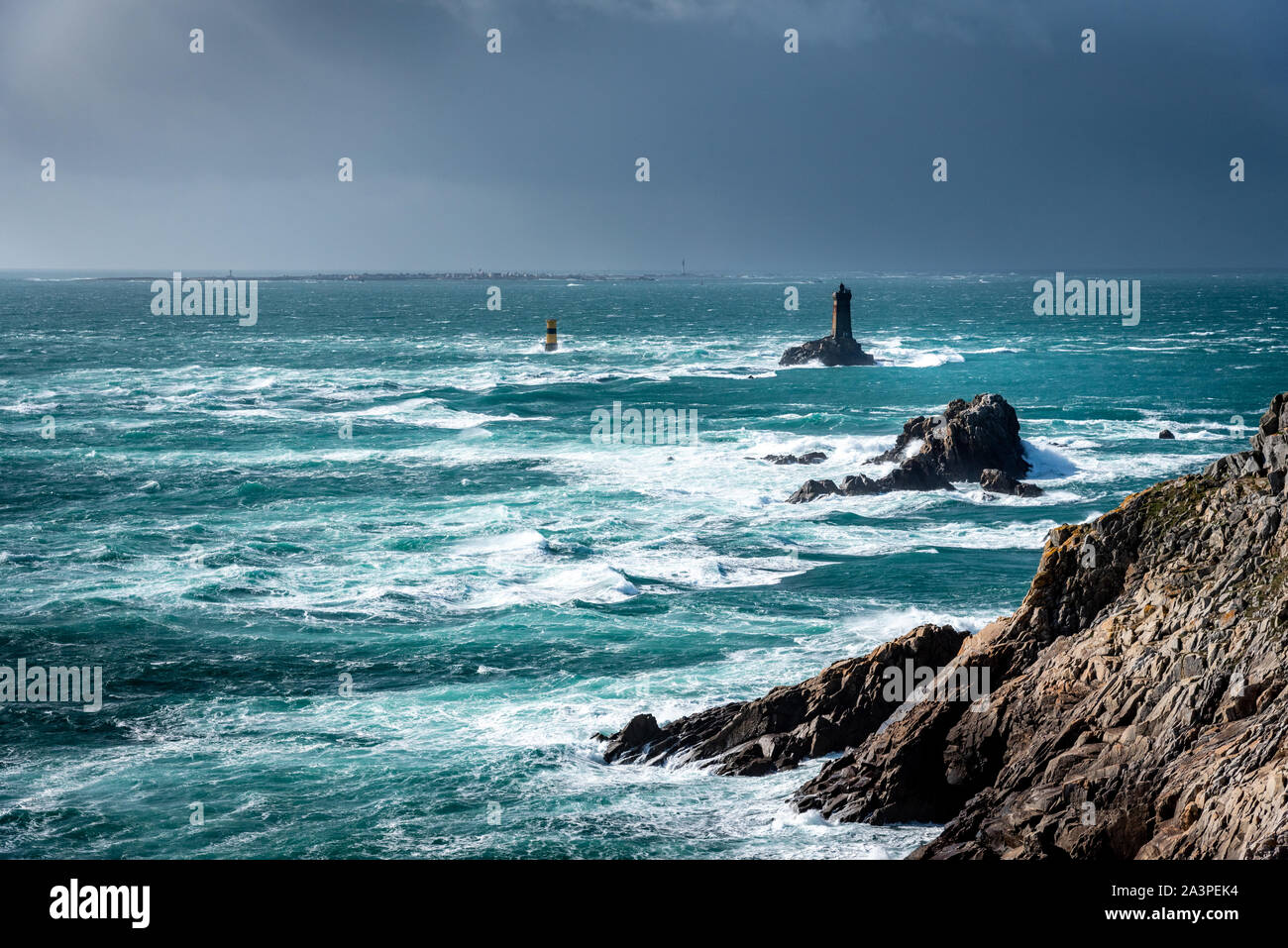 The Pointe du Raz, Brittany. This rocky cape faces the island of Sein. The giant waves of the Atlantic Ocean are shattered on the rocks. Stock Photo
