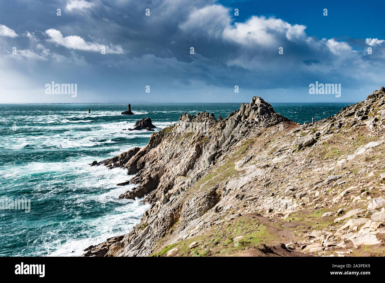 The Pointe du Raz, Brittany. This rocky cape faces the island of Sein. The giant waves of the Atlantic Ocean are shattered on the rocks. Stock Photo