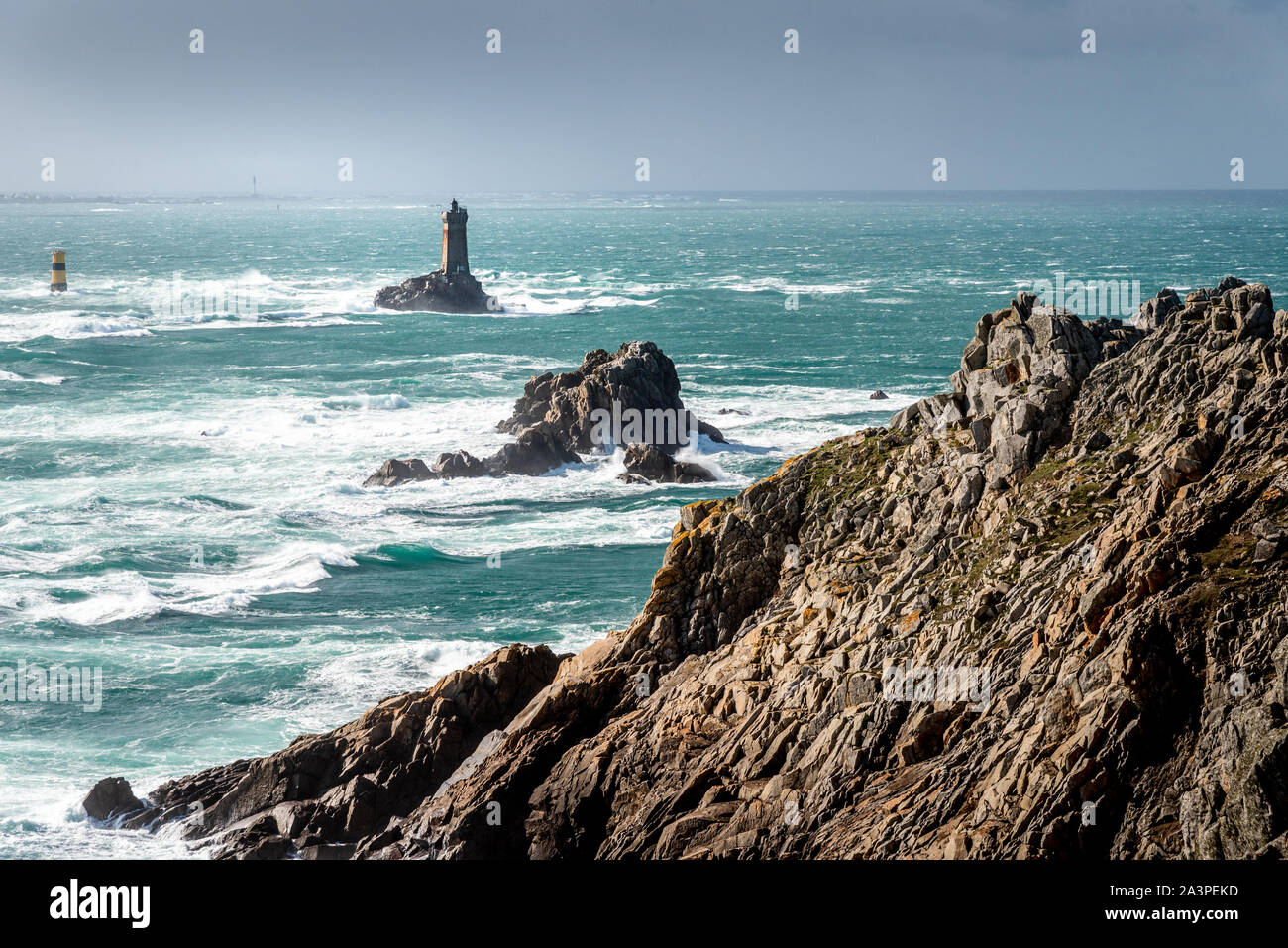 The Pointe du Raz, Brittany. This rocky cape faces the island of Sein. The giant waves of the Atlantic Ocean are shattered on the rocks. Stock Photo