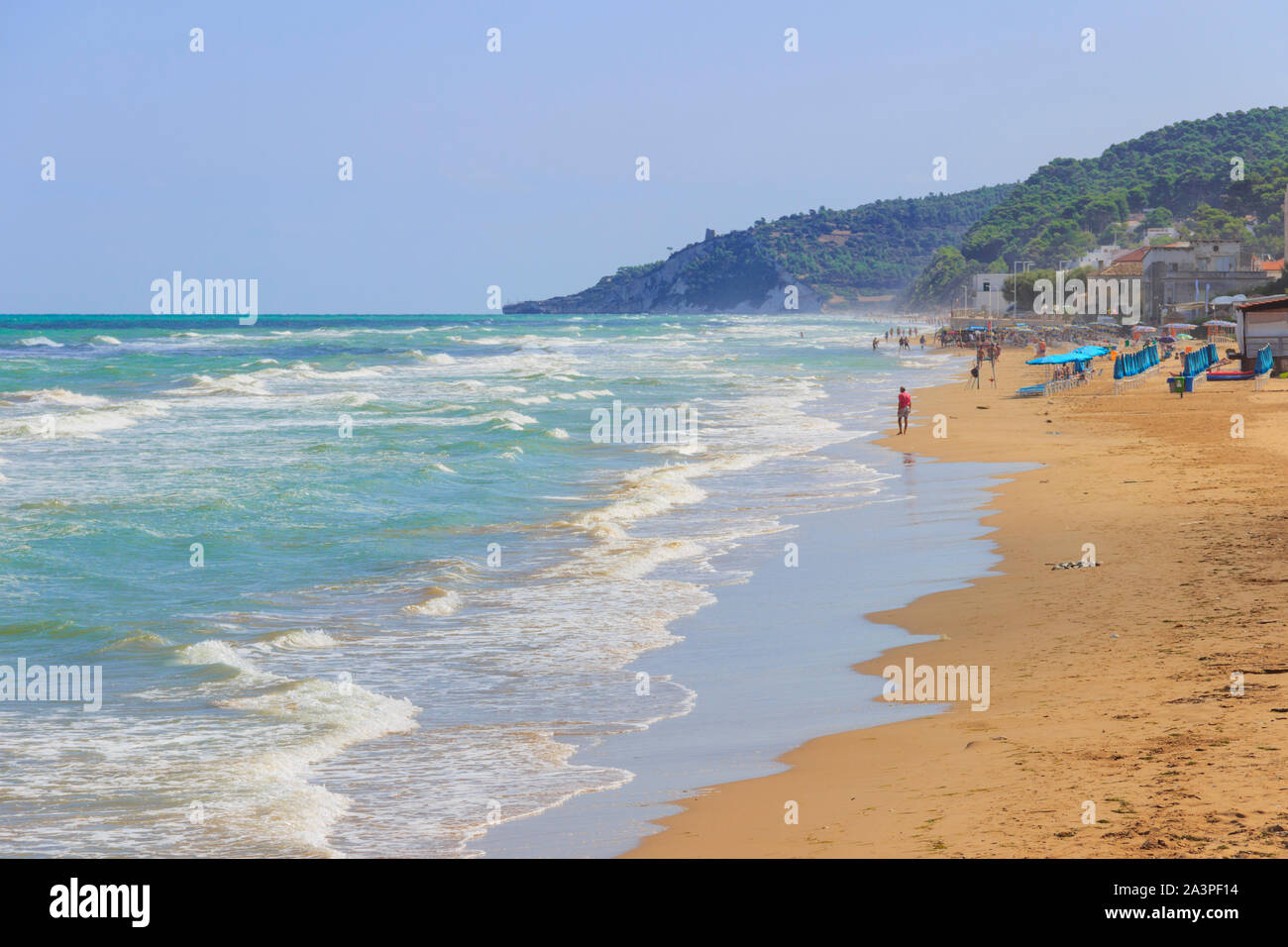 Walking on the beach. Apulia coast: San Menaio Beach in Gargano National Park, Italy. Stock Photo