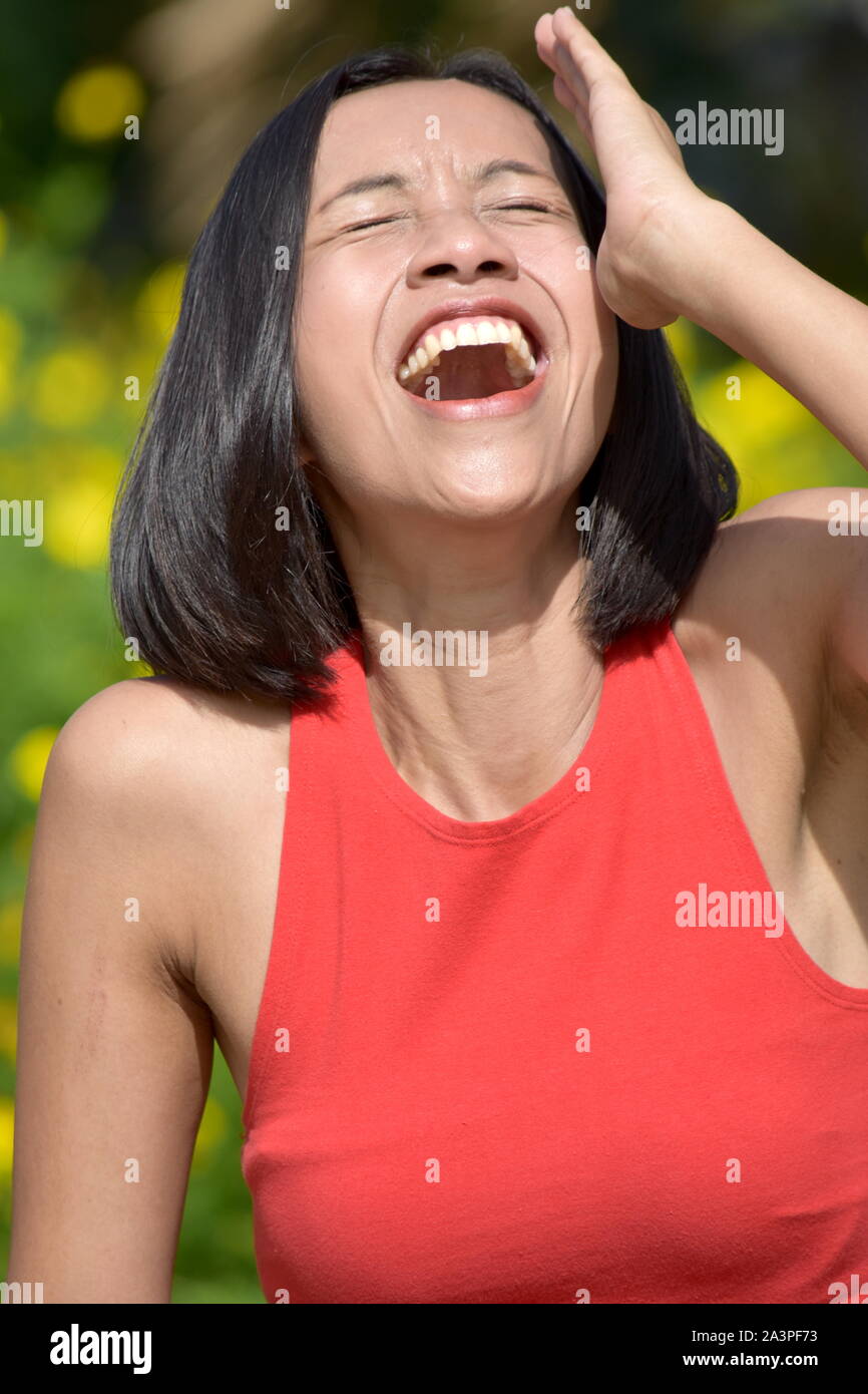 An Attractive Asian Female Laughing Stock Photo