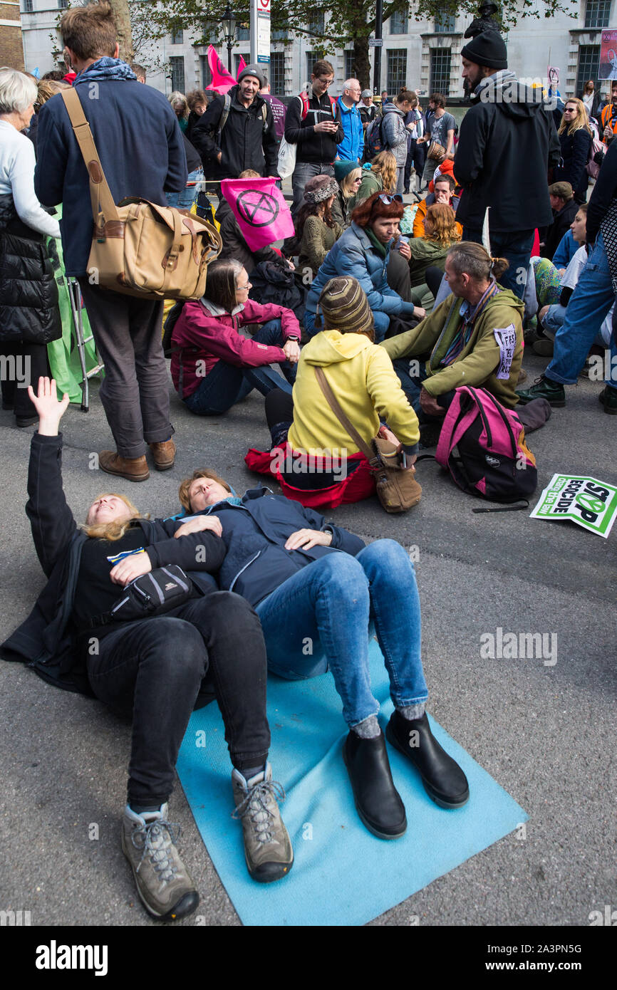 London, UK. 9 October, 2019. Climate activists from Extinction Rebellion blockade Whitehall on the third day of International Rebellion protests to demand a government declaration of a climate and ecological emergency, a commitment to halting biodiversity loss and net zero carbon emissions by 2025 and for the government to create and be led by the decisions of a Citizens’ Assembly on climate and ecological justice. Credit: Mark Kerrison/Alamy Live News Stock Photo