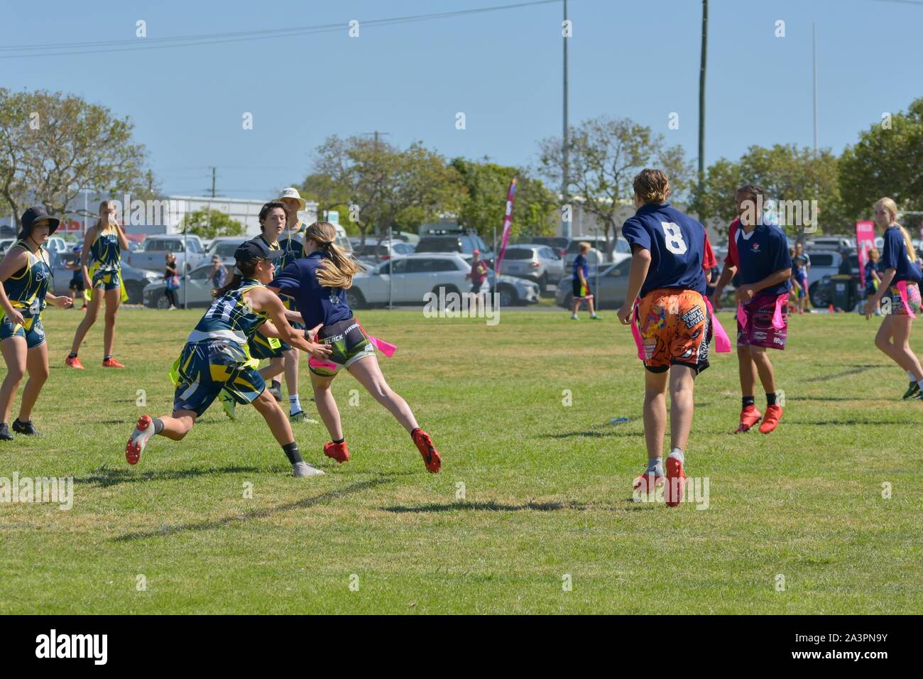 Editorial photo of teenager playing a game of Oztag. Stock Photo