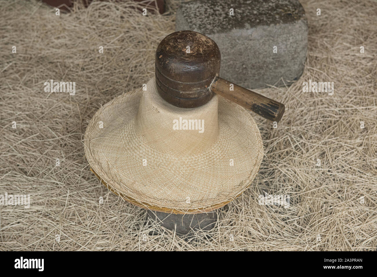 Flattening a Panama hat (paja toquilla), which actually comes from Ecuador Stock Photo