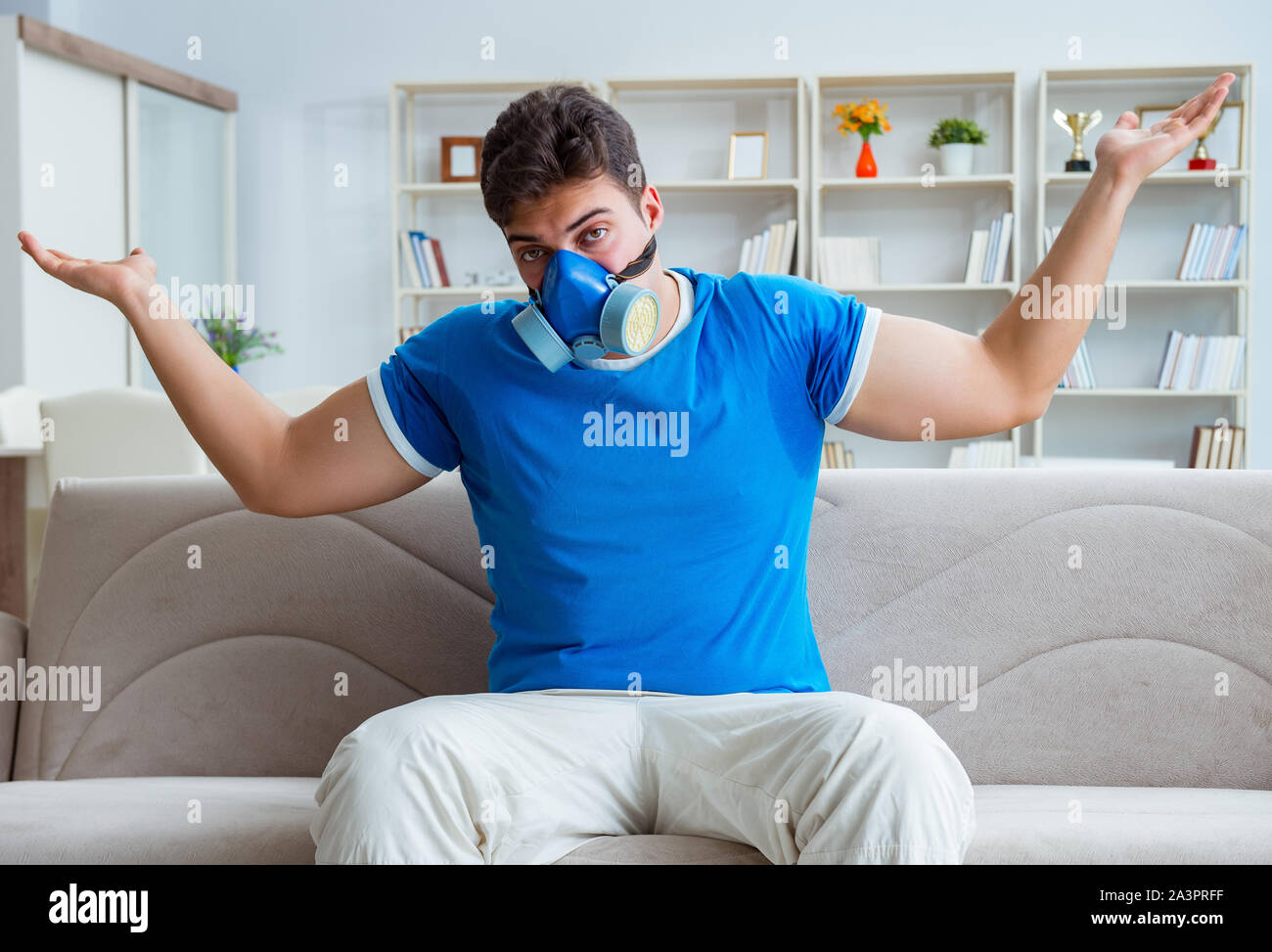 The man sweating excessively smelling bad at home Stock Photo Alamy