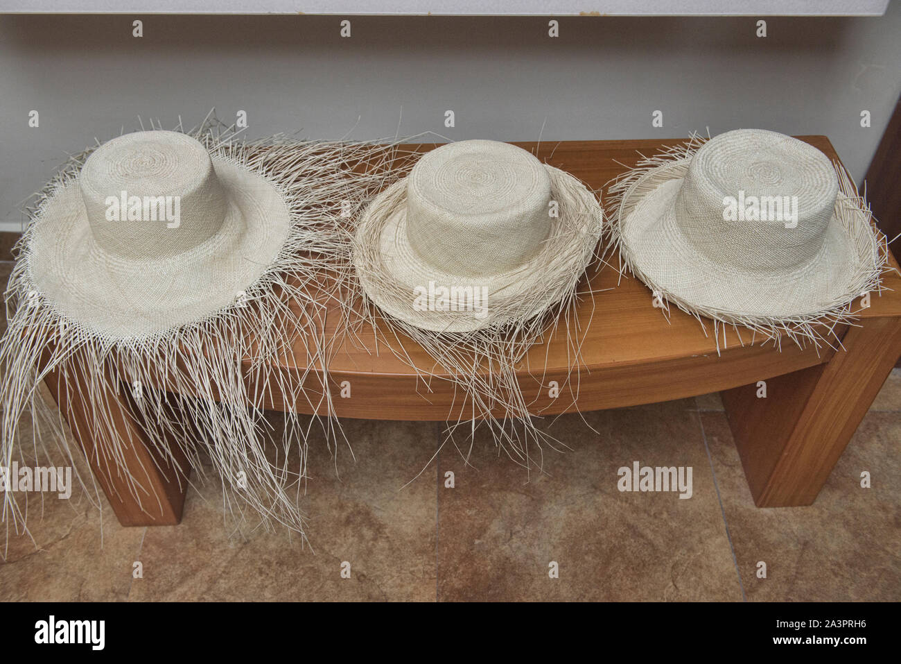 Weaving straw into Panama hats (paja toquilla), which actually come from Ecuador Stock Photo