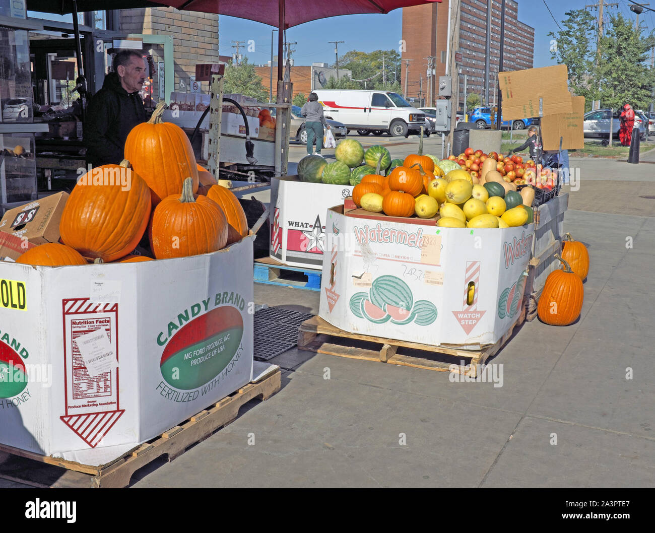Pumpkins, squash, apples, and watermelons for sale outside the West Side Market in Ohio City in Cleveland, Ohio during the fall autumn season. Stock Photo