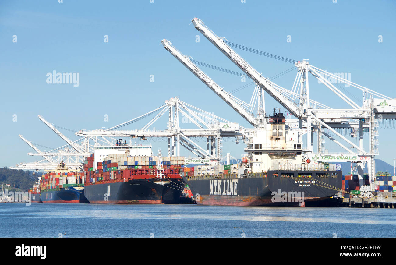 Oakland, CA February 22, 2019 Multiple cargo ships loading at the