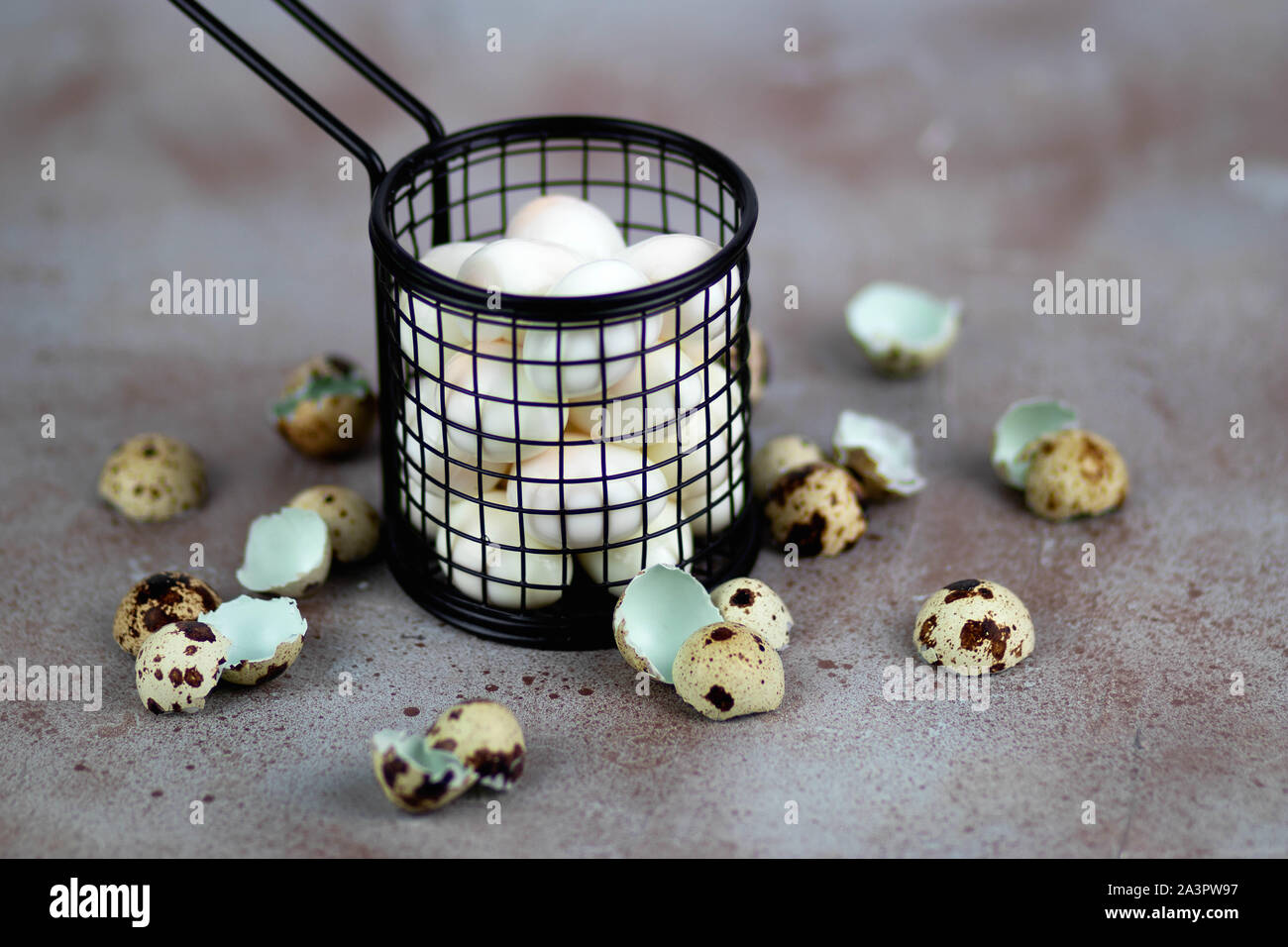 Quail eggs in a basket Stock Photo