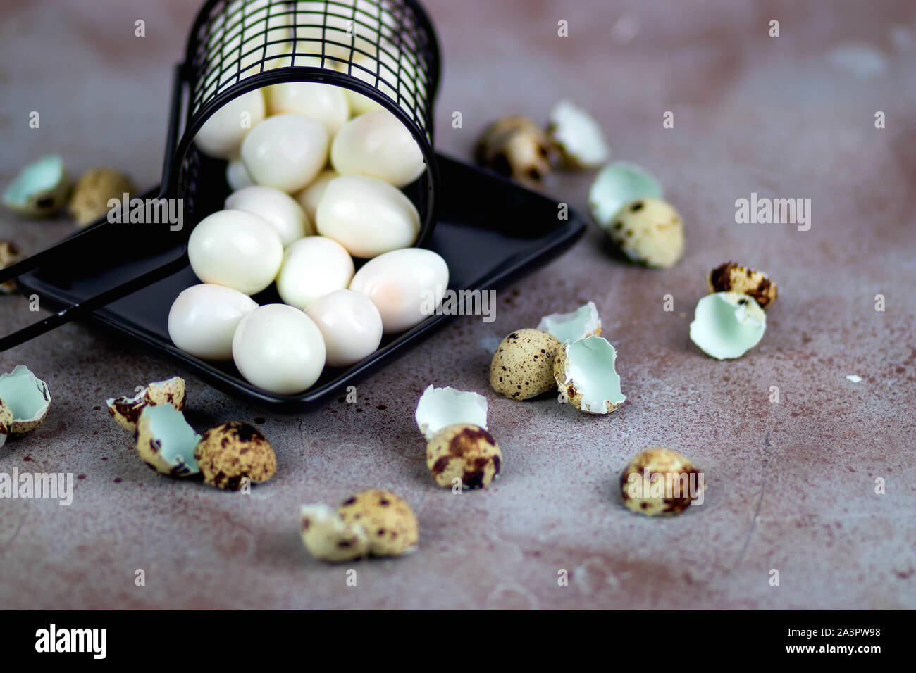 Quail eggs in a basket Stock Photo