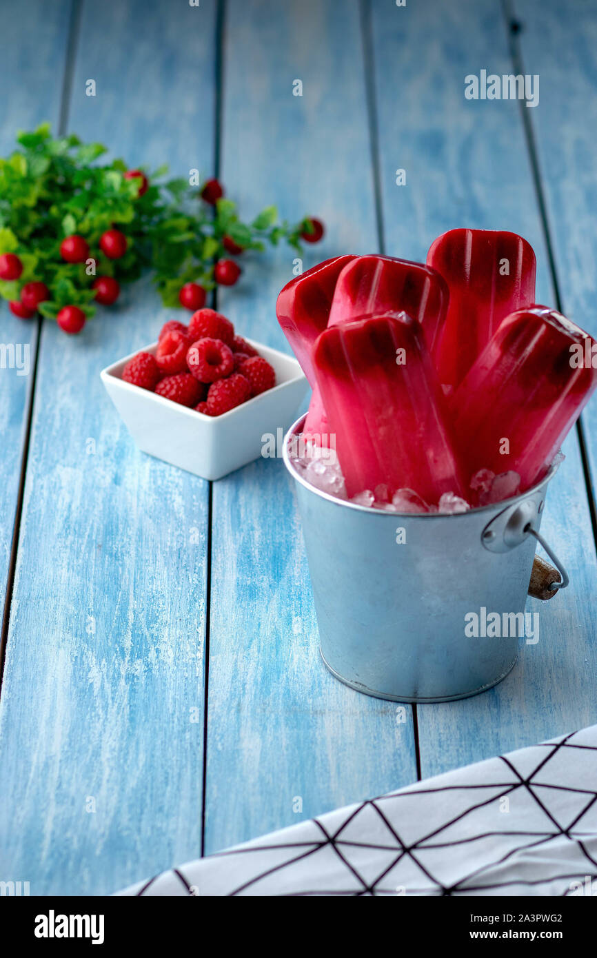 Raspberry popsicles on ice Stock Photo
