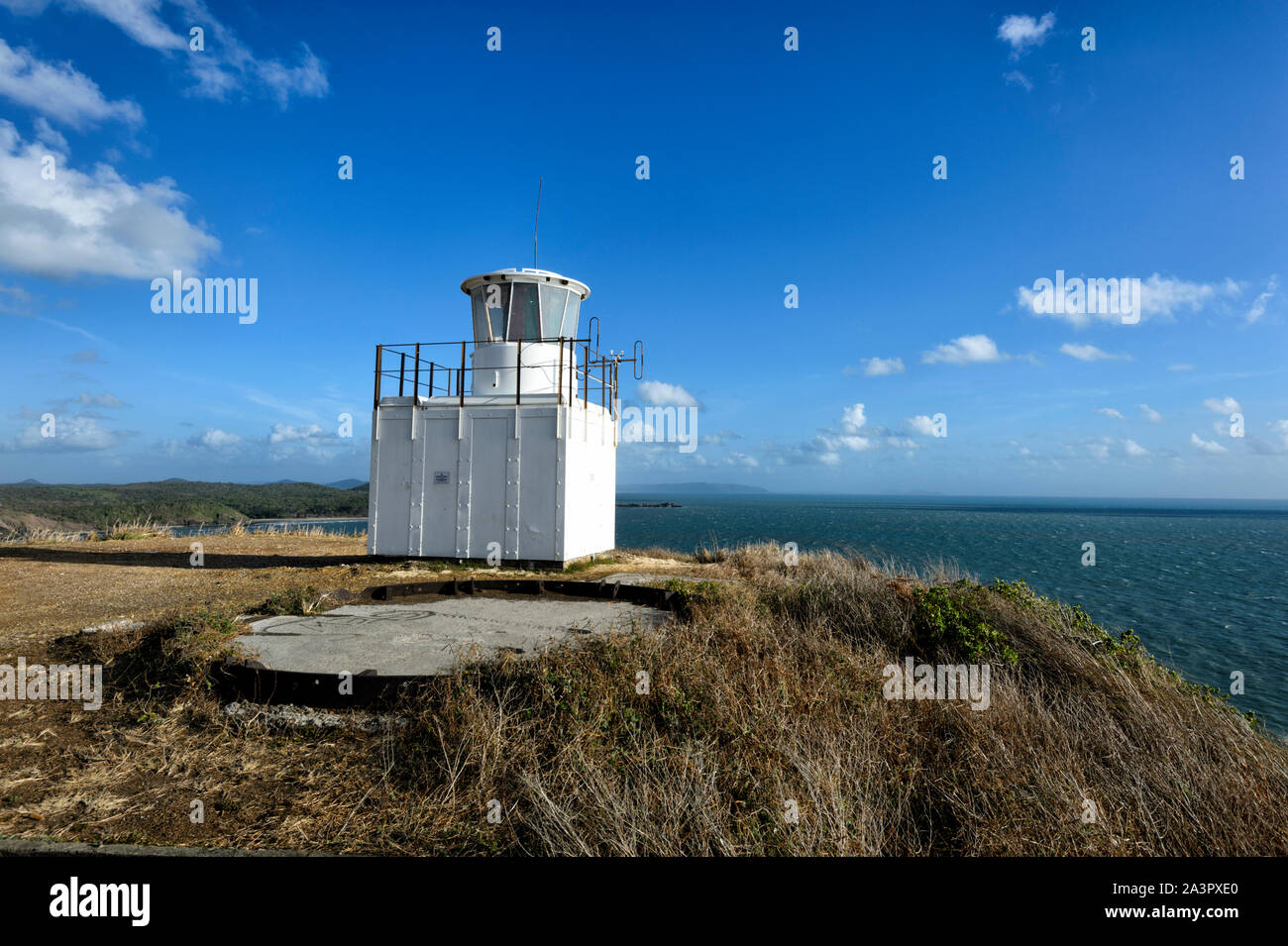 White lighthouse at the top of a cliff at Archer Point, near Cooktown