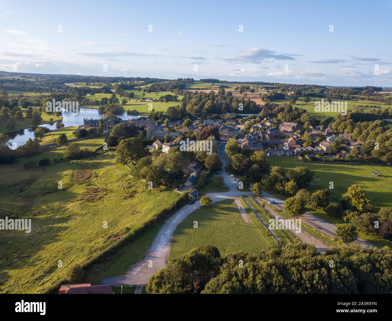 Aerial views of Ripley Castle in Harrogate, North Yorkshire on a partly cloudy evening Stock Photo