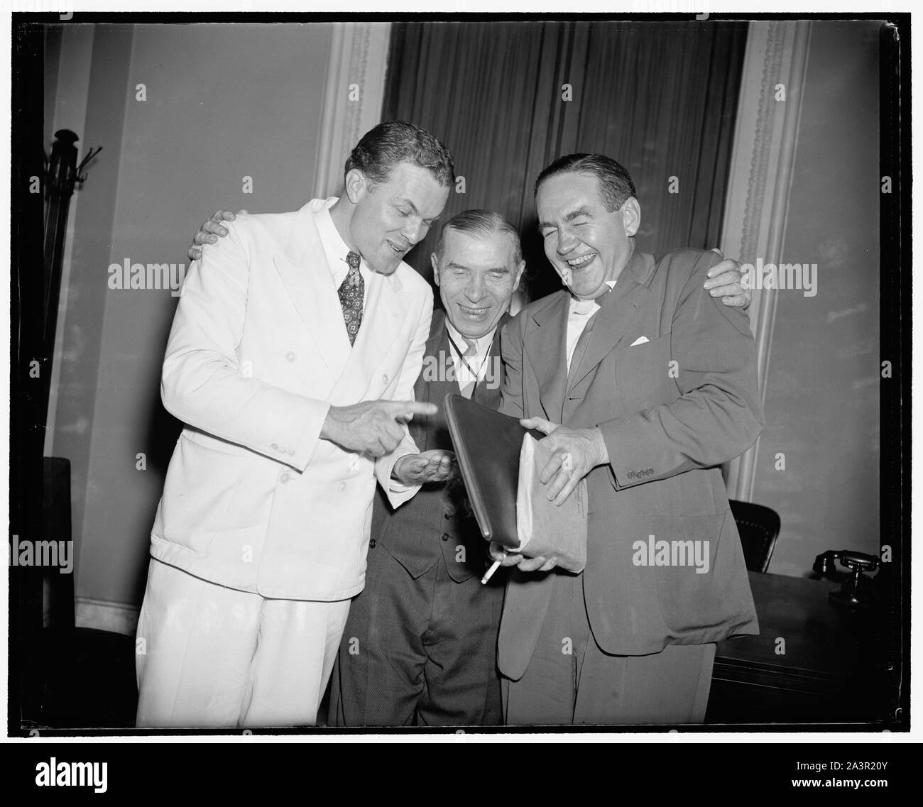 Still friends after House battle of neutrality. Washington, D.C., July 1. After the House went through one of the administration's severest setbacks last night on the neutrality measure, principals involved remain good friends. Rep. Robert Allen of Pennsylvania, Sol Bloom of New York, and Republican John Vorys of Ohio, met after the Bloom Bill went through with amendments which constituted a setback to the administration's Neutrality Bill proposed by Bloom, and agreed that it was a great fight with no grudges. Rep. Vorys led the republican fight that changed the bill and Rep. Allen was a stron Stock Photo