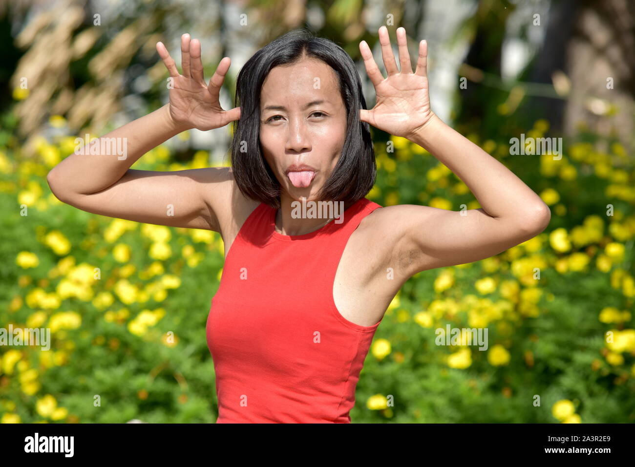 Filipina Woman Making Funny Faces Stock Photo