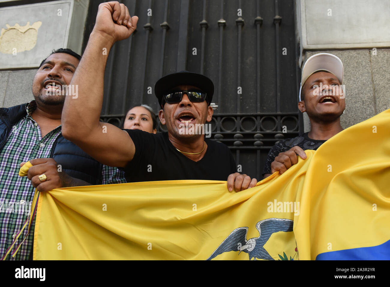 Madrid, Spain. 09th Oct, 2019. Protesters shout slogans during the demonstration.Ecuadorian nationals gathered in front of the Embassy of Ecuador in Madrid to protest against Lenin Moreno and his austerity measures. Credit: SOPA Images Limited/Alamy Live News Stock Photo