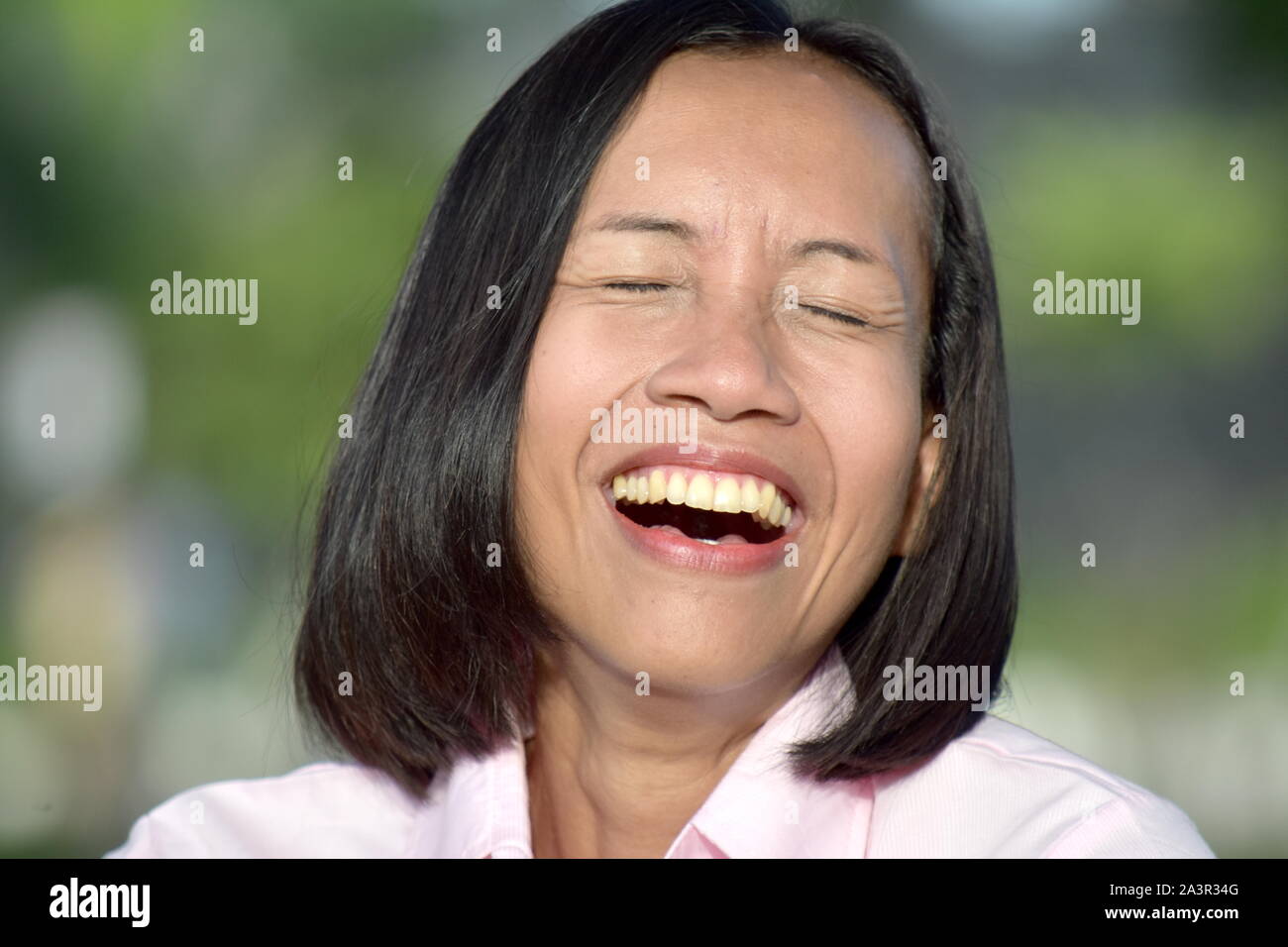 Youthful Filipina Woman And Laughter Stock Photo