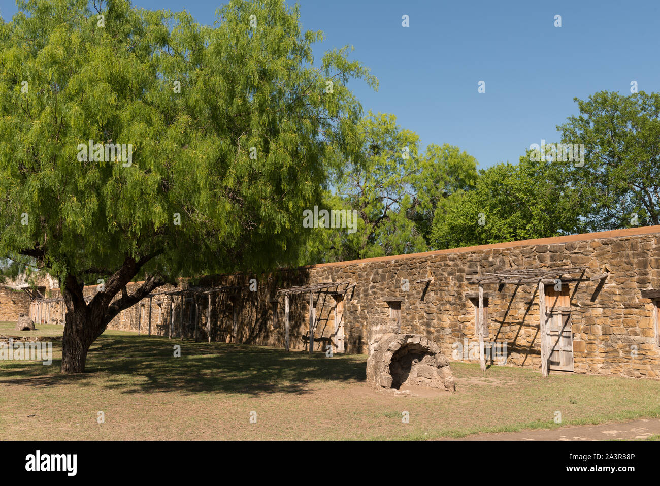 Stone wall, a brick oven, and a simple arbor at Mission Nuestra Senora ...