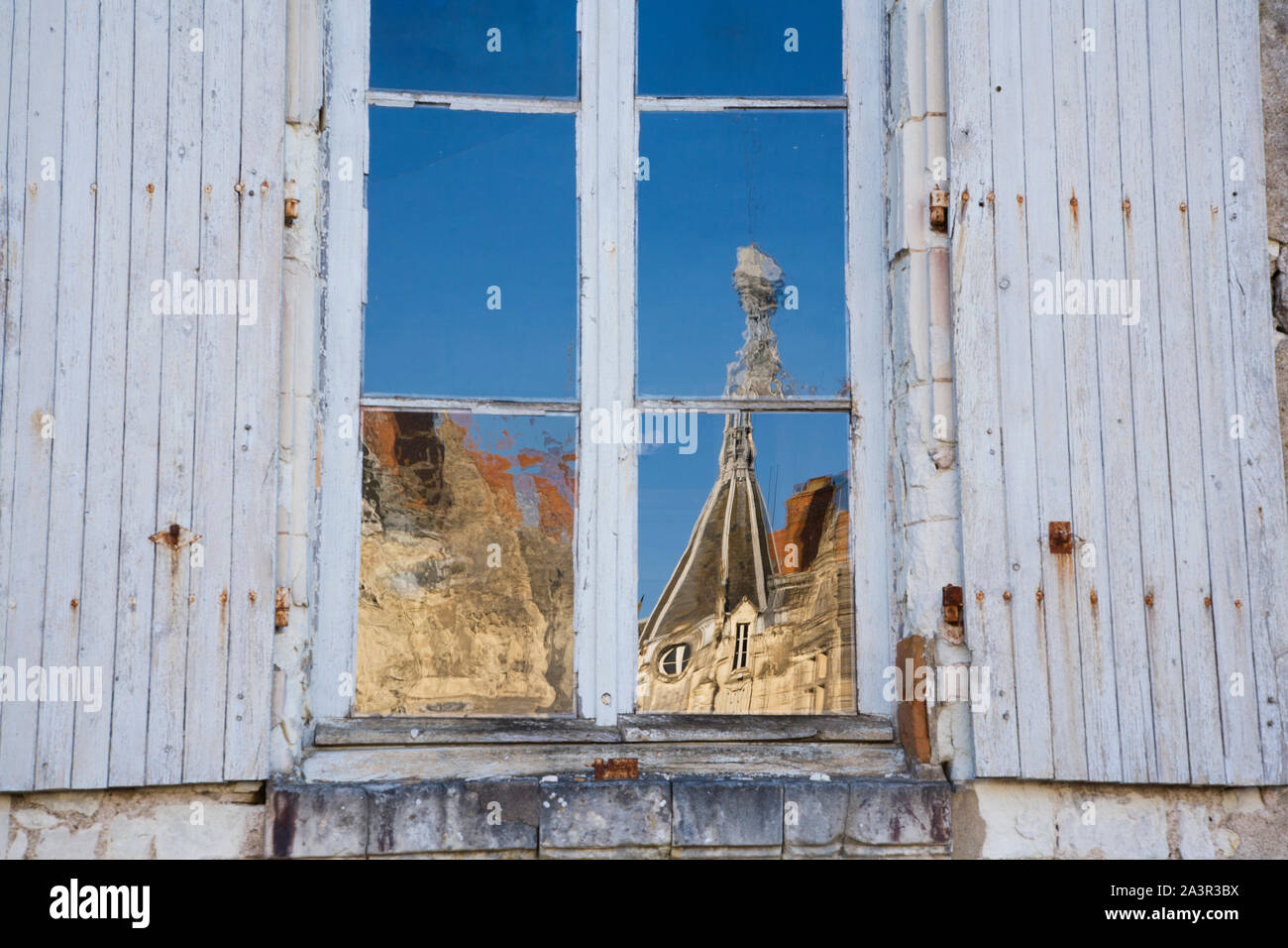Chateau reflected in window Stock Photo