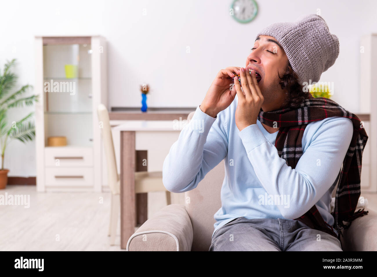 Young man suffering from flu at the home Stock Photo