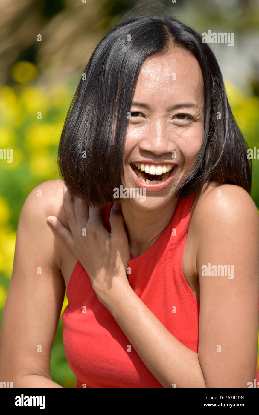 Young Filipina Woman And Laughter Stock Photo