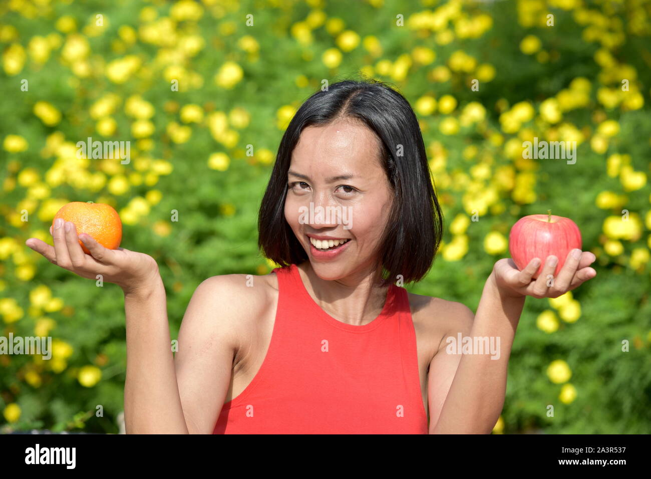 Happy Adult Female With Fruit Stock Photo