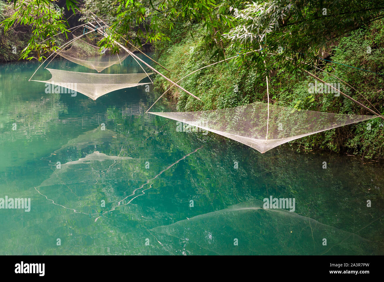 Traditional fishing nets and tools along river Stock Photo Alamy