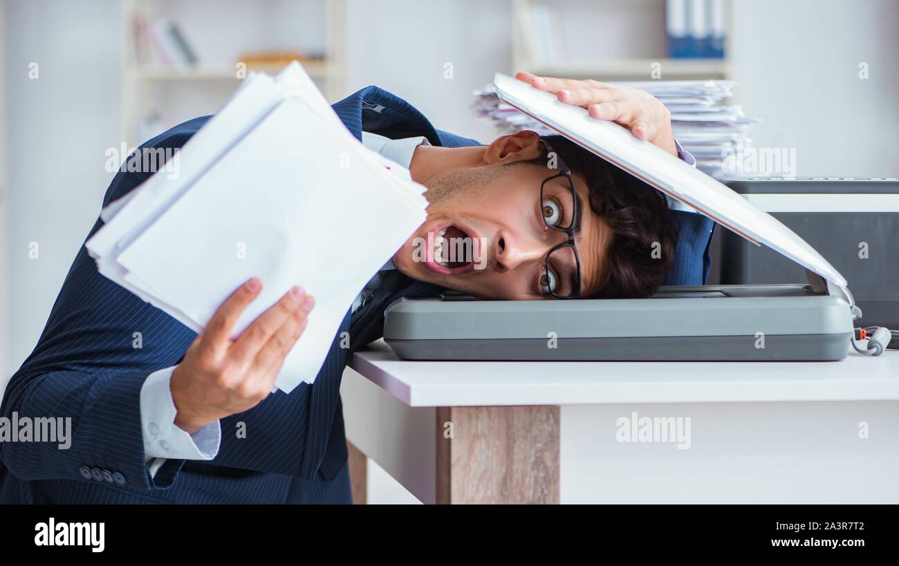 The businessman making copies in copying machine Stock Photo - Alamy