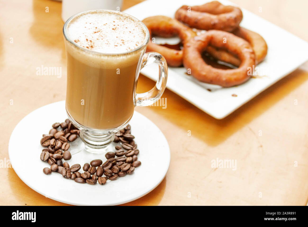 Enjoying coffee with milk and dessert Stock Photo