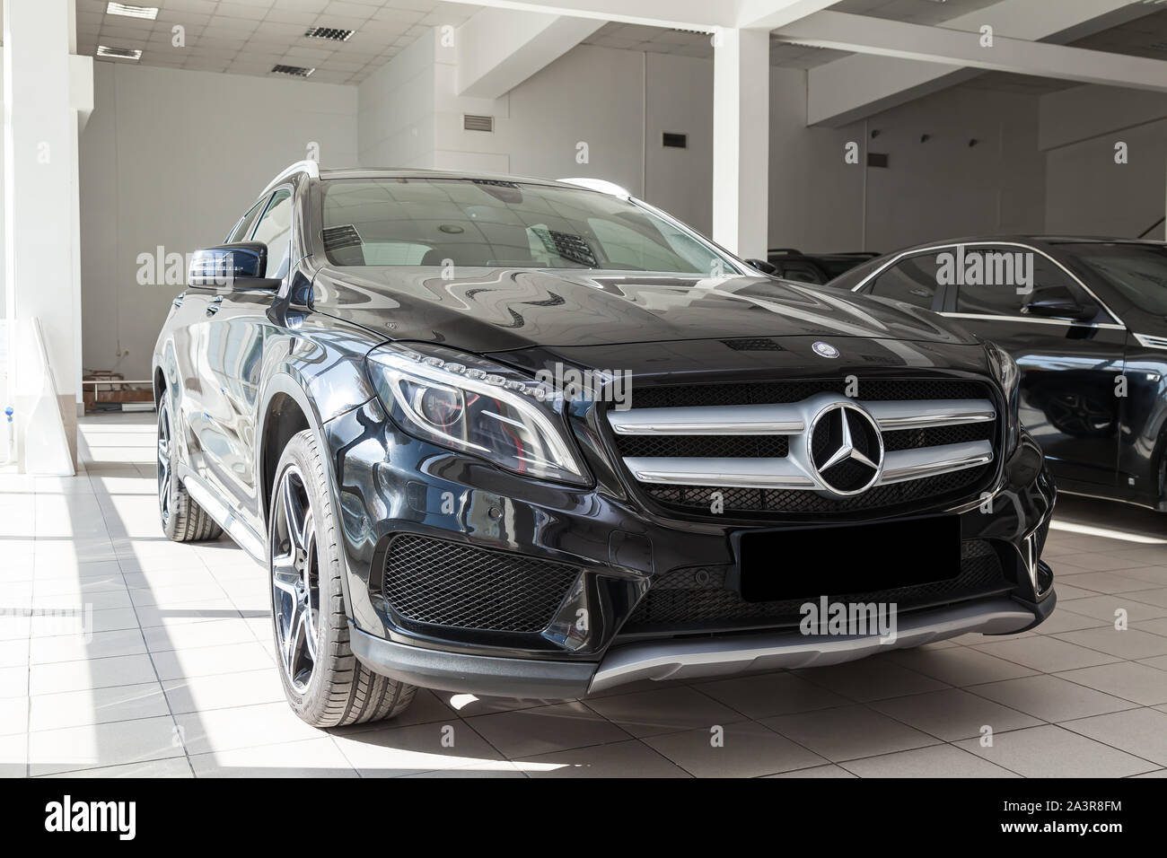 Novosibirsk, Russia - 08.01.2018: Black Mercedes Benz Gla class 2016 year front view with dark gray interior in excellent condition in a dealership wi Stock Photo