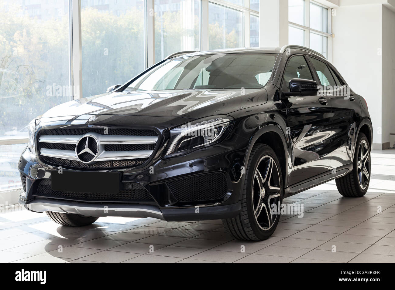 Novosibirsk, Russia - 08.01.2018: Black Mercedes Benz Gla class 2016 year front view with dark gray interior in excellent condition in a dealership wi Stock Photo