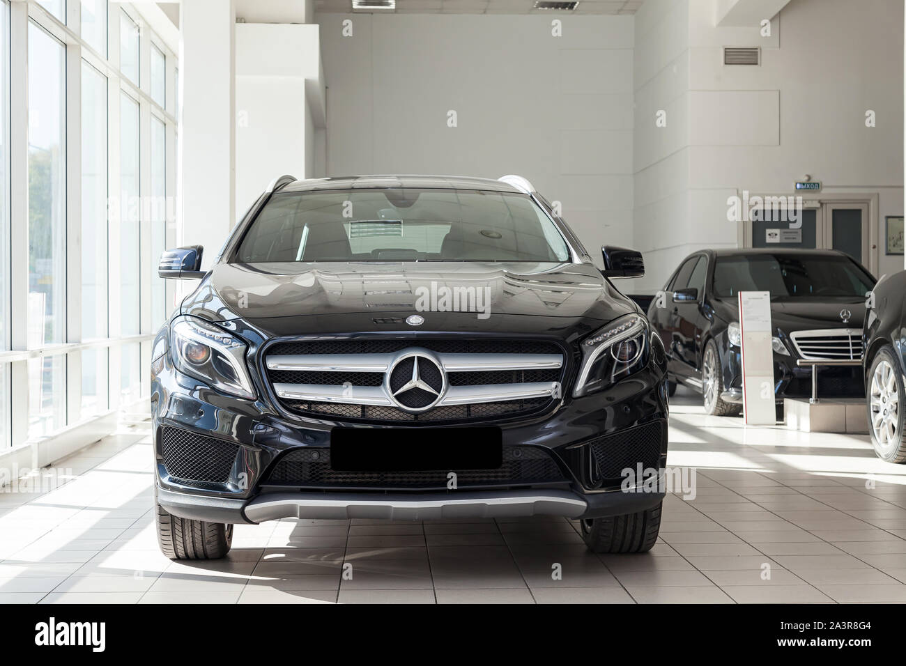 Novosibirsk, Russia - 08.01.2018: Black Mercedes Benz Gla class 2016 year front view with dark gray interior in excellent condition in a dealership wi Stock Photo