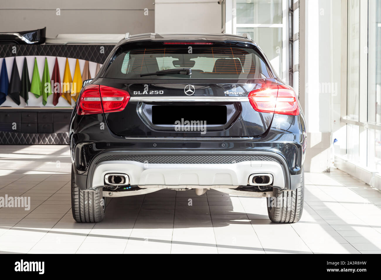 Novosibirsk, Russia - 08.01.2018: Black Mercedes Benz Gla class 2016 year rear view with dark gray interior in excellent condition in a dealership wit Stock Photo
