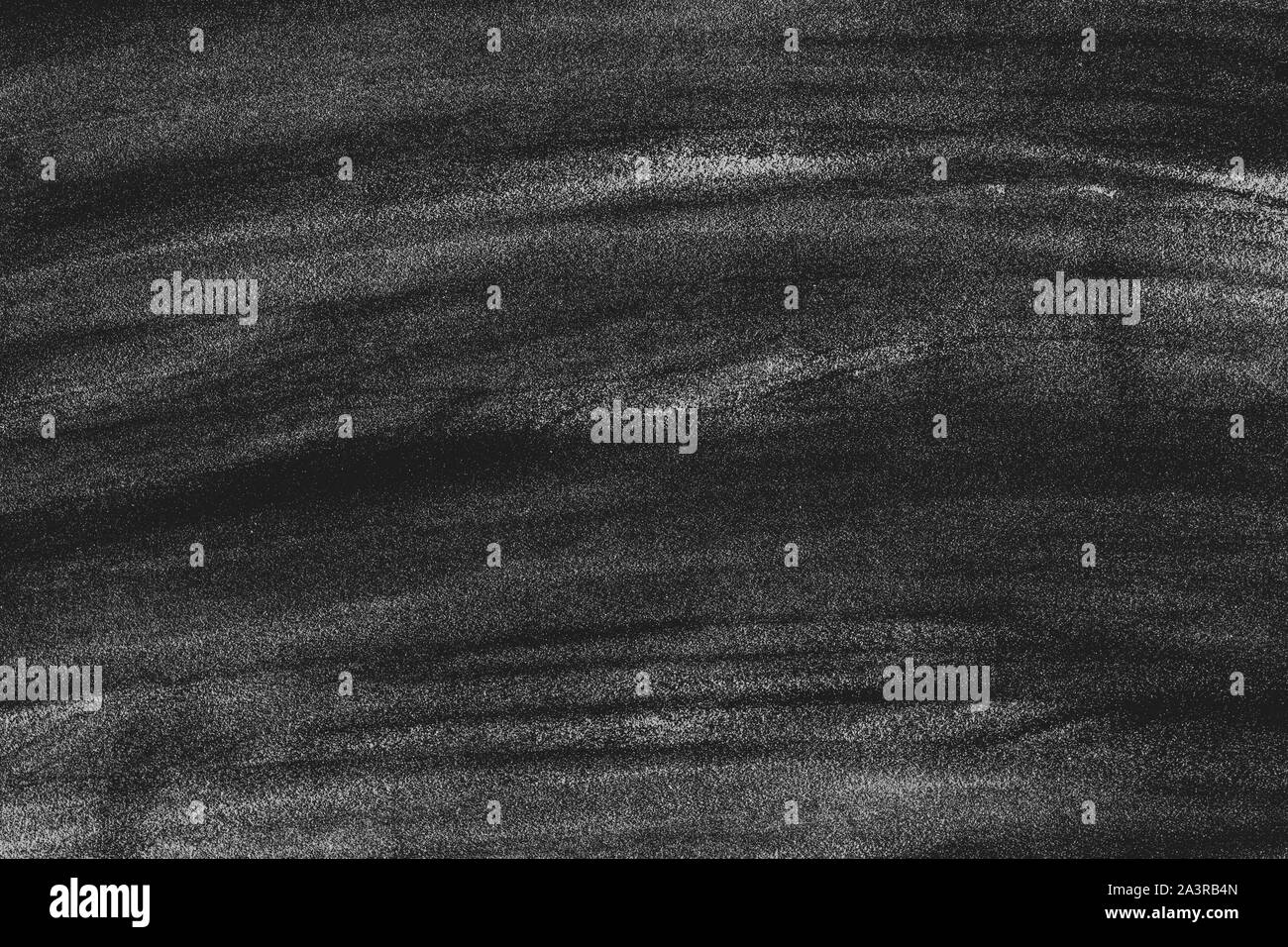 Dirty chalkboard background. Whte chalk stains on blackboard after